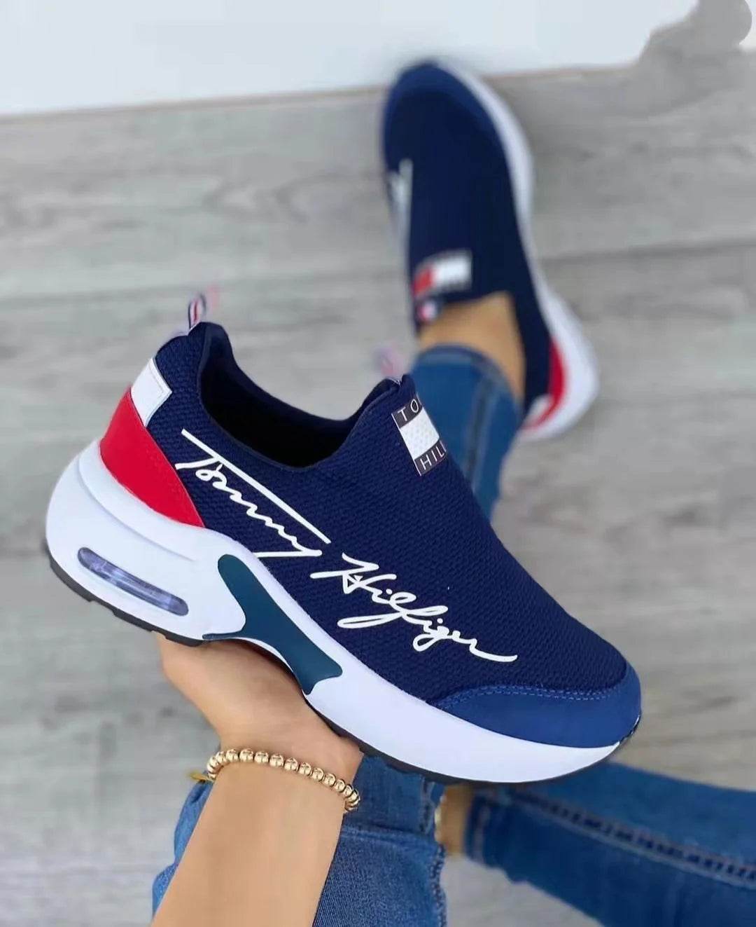 Women's Air Cushion Slip-on Sneakers in white, red, black, and navy blue