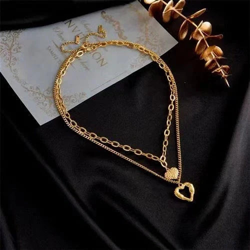 Titanium Steel Angel Wings Love Necklace with heart-shaped pendants and irregular folds design