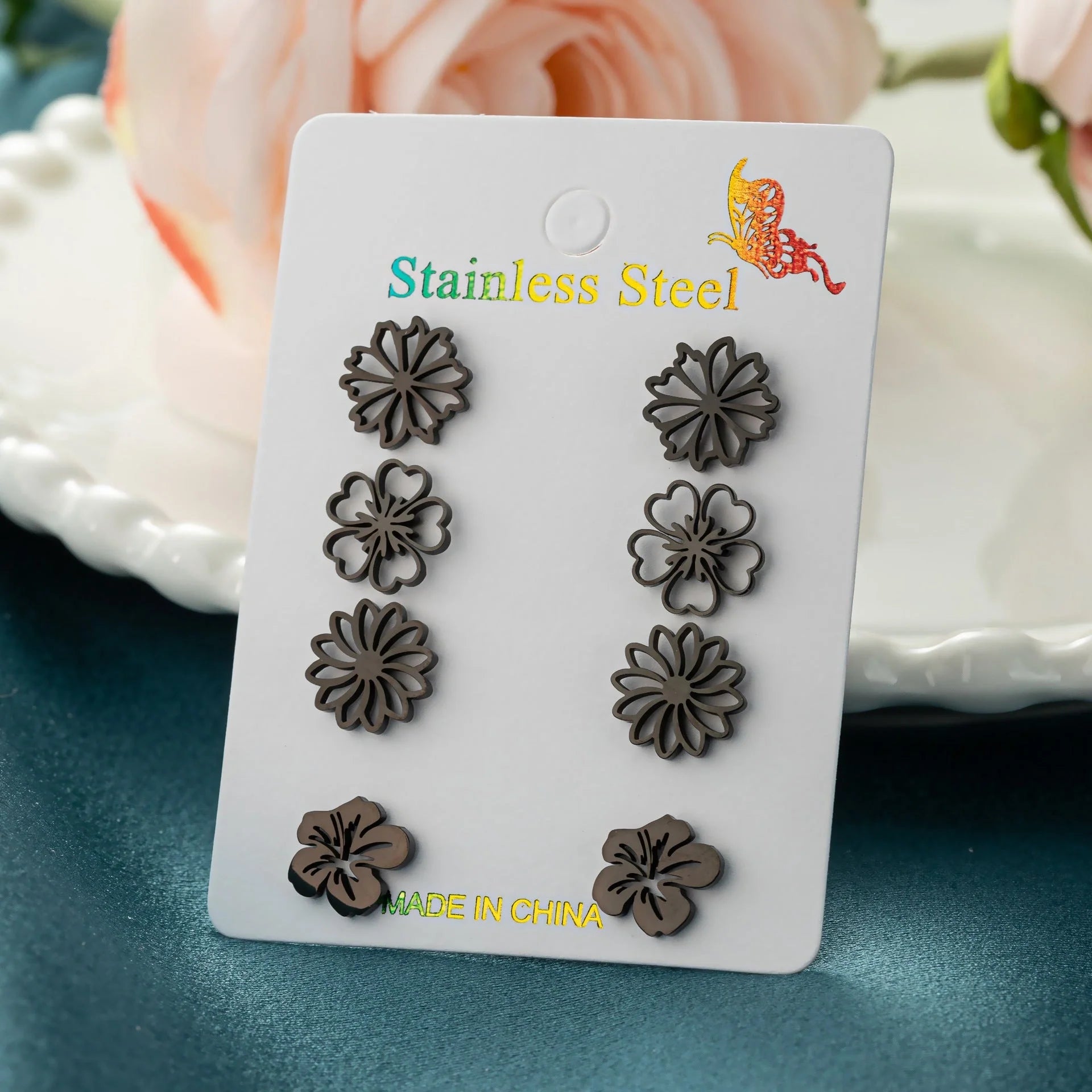Fashion simulation stud earrings in gold, steel, rose gold, and black