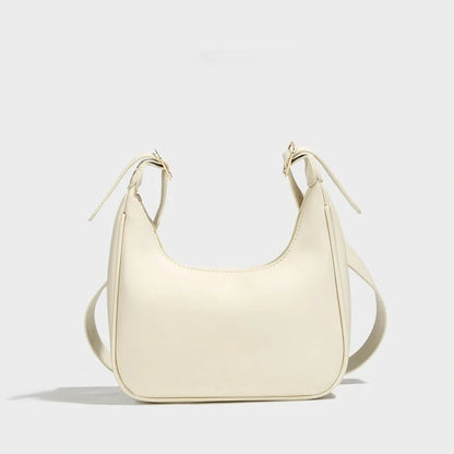 Stylish women's PU leather dumpling crossbody bag in black and white