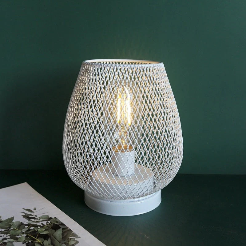 Retro iron art table lamp with hollowed out birdcage design and glass shade