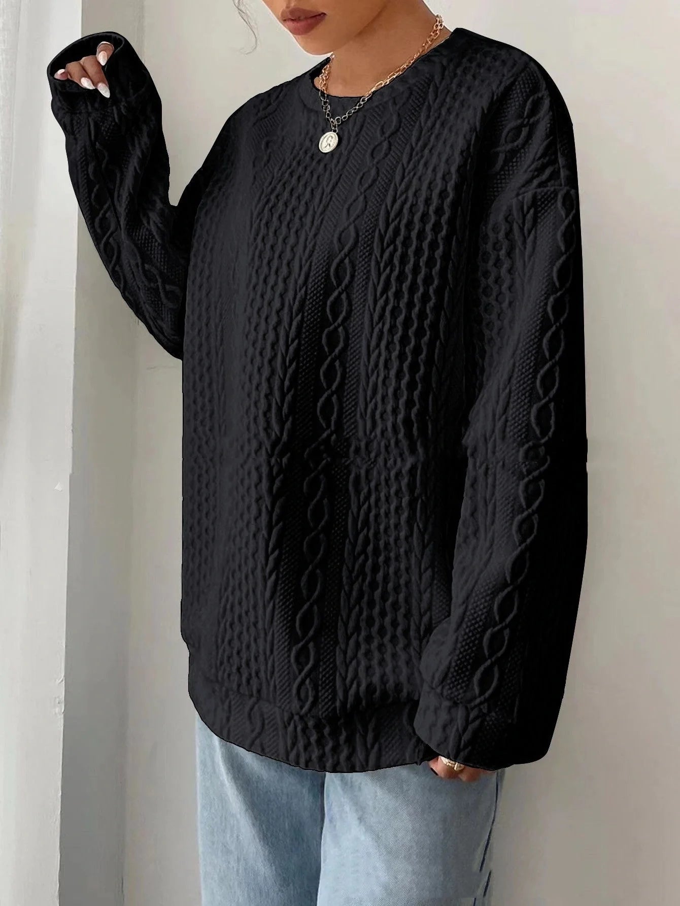 Cosy and stylish women's oversized jacquard hoodie in black, white, and blue colours
