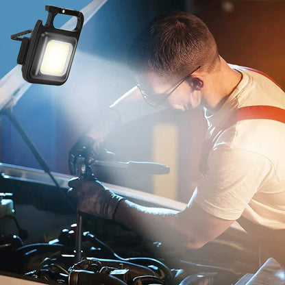 Powerful USB-rechargeable keychain flashlight with three lighting modes, magnetic base, and foldable handle for outdoor and emergency use