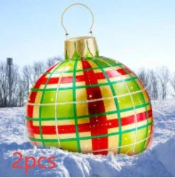 Vibrant inflatable Christmas baubles in a variety of colours and patterns, perfect for outdoor holiday decoration