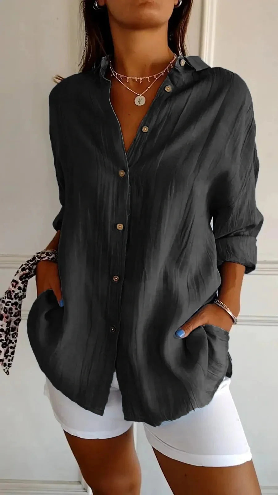 A stylish long-sleeved shirt with a pleated design, available in a variety of colours to suit any occasion.
