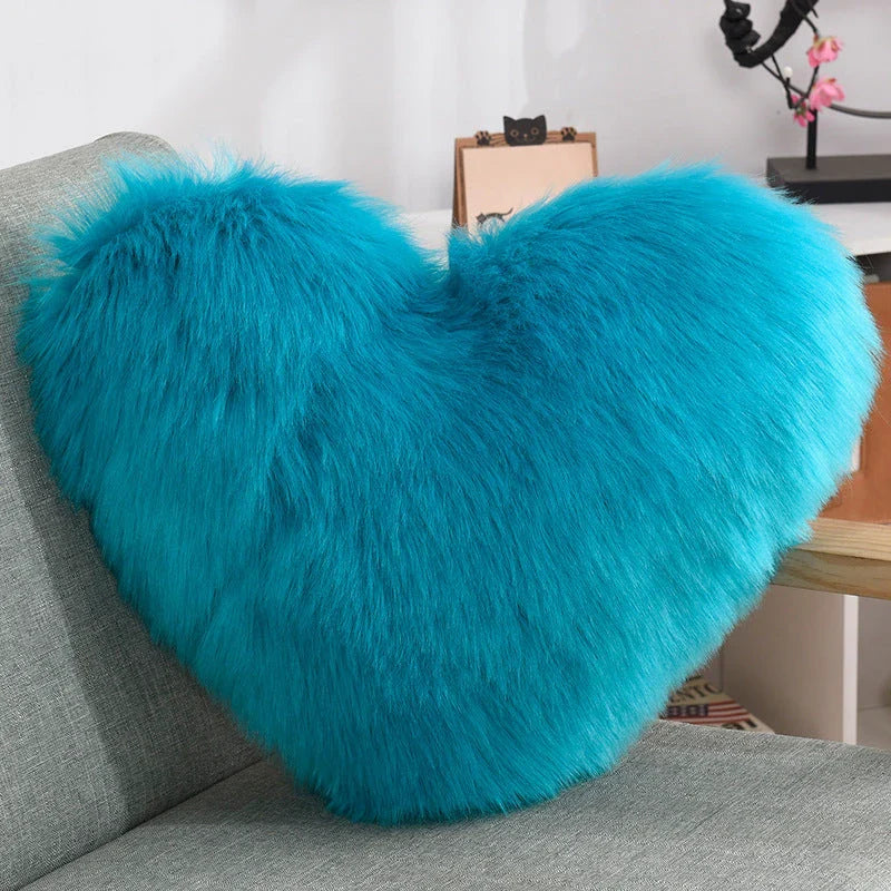 Cozy heart-shaped throw pillow with plush, shaggy texture in various colors