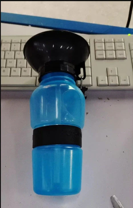 Portable pet water bottle with squeeze-feed bowl for dogs and cats