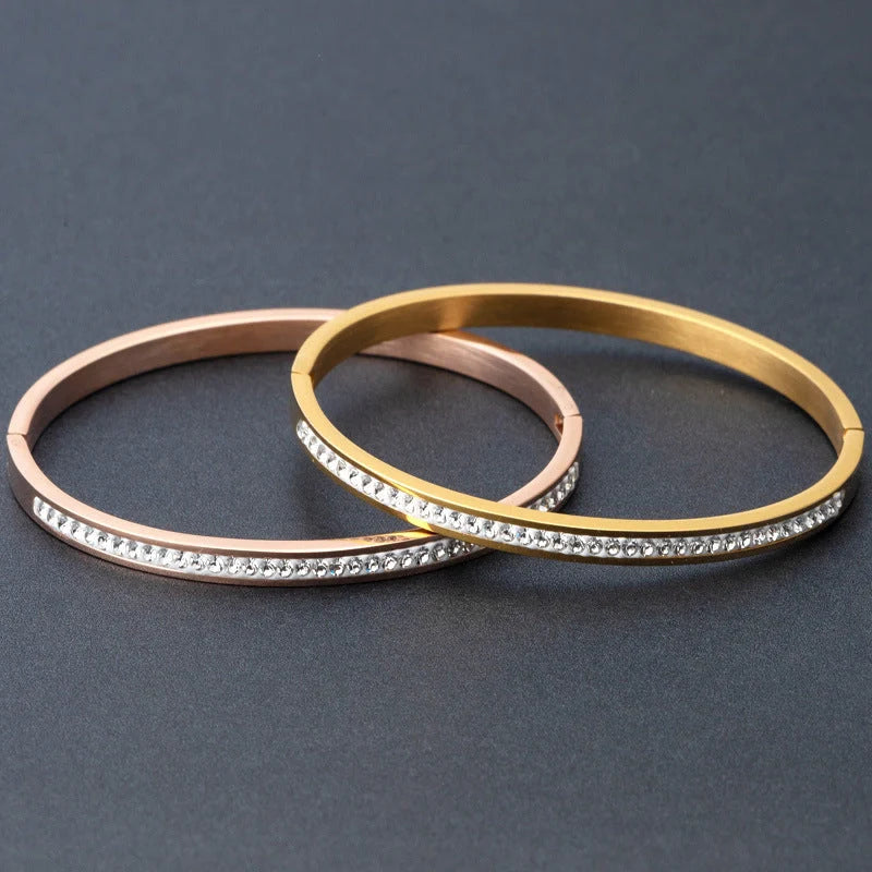 Single row stainless steel bracelet with diamond opening in gold, rose gold, or steel colour