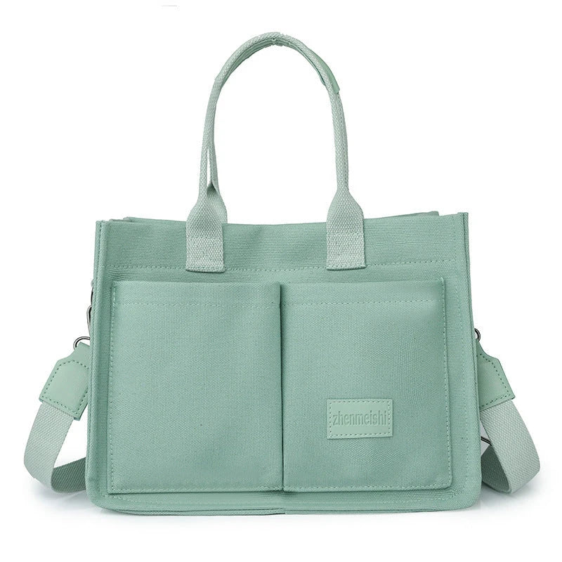 Stylish and durable canvas tote bag with multiple pockets for everyday use
