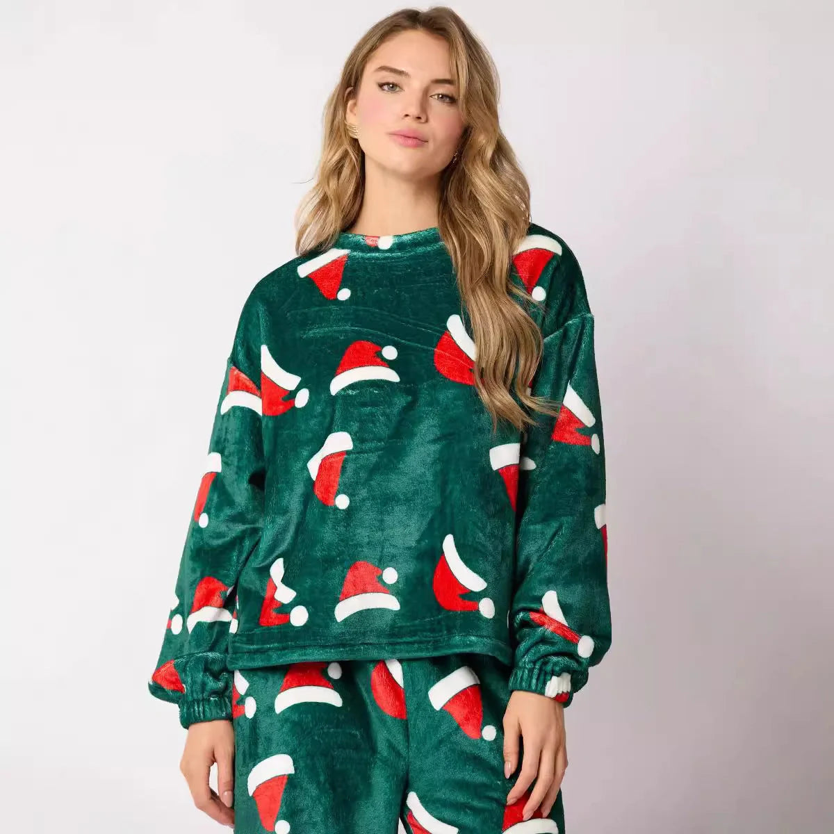 Women's festive flannel pajama set with Santa Claus design and long sleeves