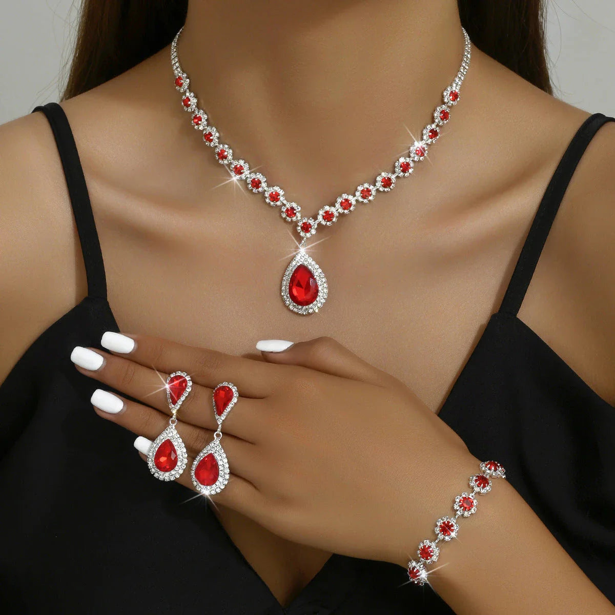 Elegant rhinestone jewelry set with necklace, earrings, and bracelet in a celestial-inspired design