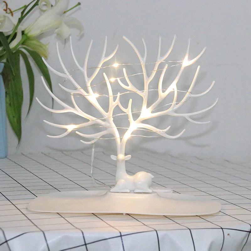 Deer Antler Jewelry Stand in white and black, displaying necklaces and earrings
