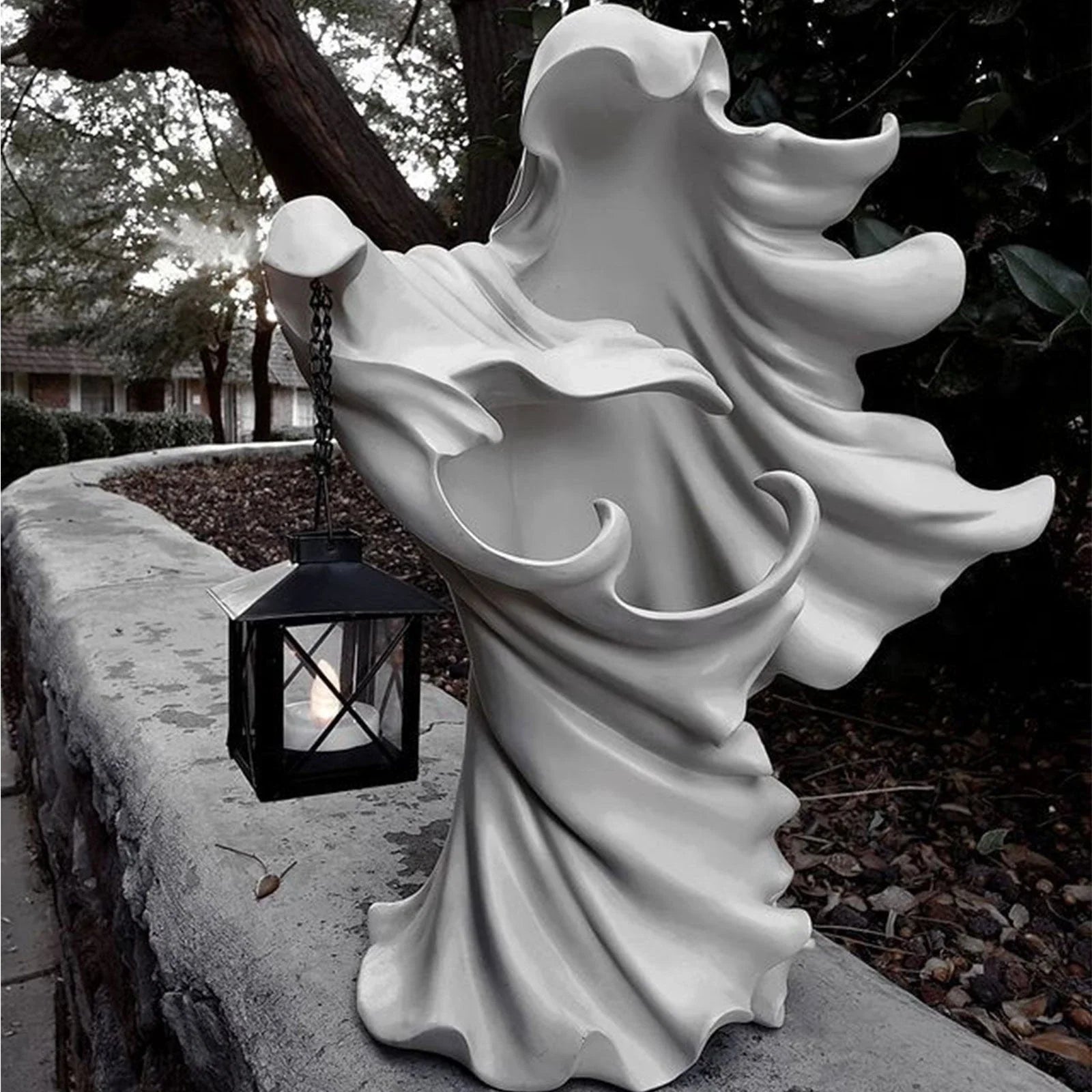 Handcrafted faceless ghost sculpture made of resin, perfect for Halloween decor and parties