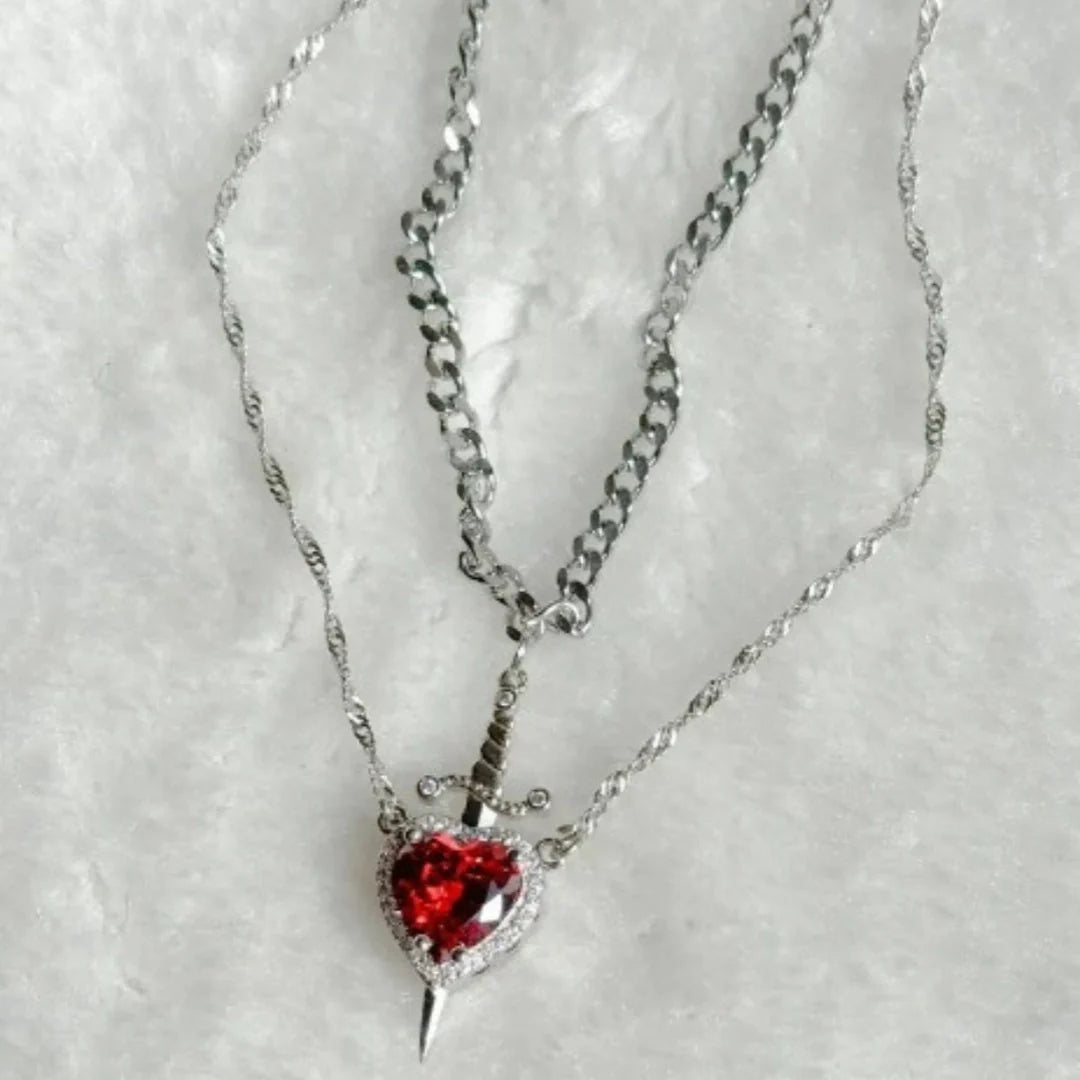 Exquisite Heart and Sword Couple Necklaces in gold and silver, symbolising love and protection