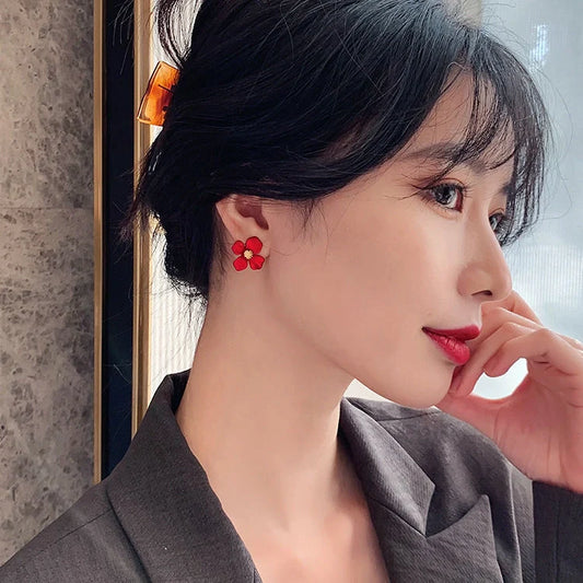 Elegant silver earrings with delicate red petal design inspired by Korean fashion