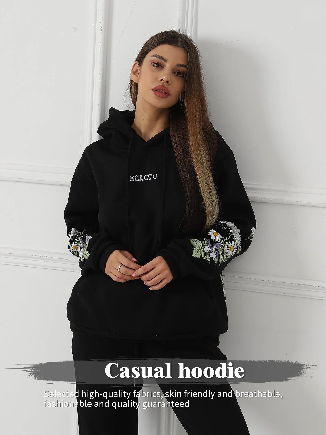 Women's floral long sleeved sweatshirt in black, blue, and apricot