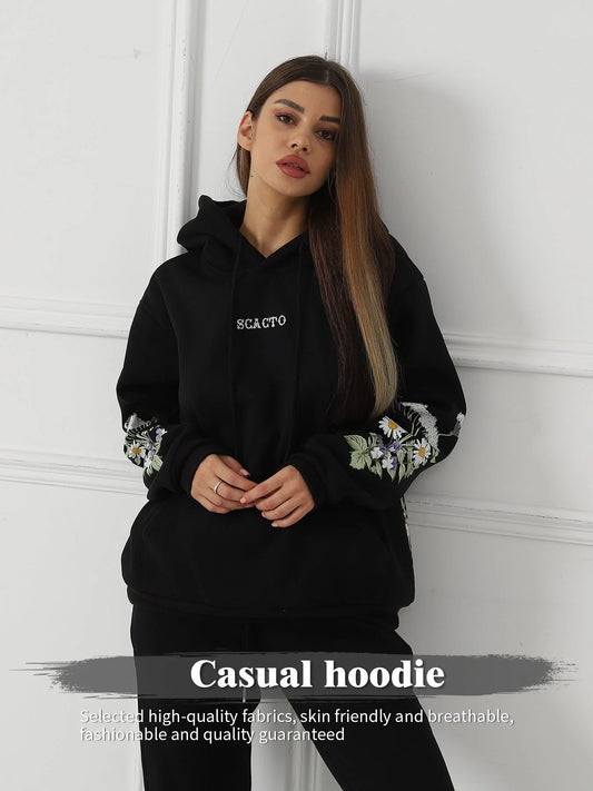 Women's floral long sleeved sweatshirt in black, blue, and apricot