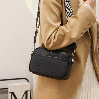 A fashionable crossbody bag with a rhombus embroidered strap, available in multiple colors including black, beige, green, blue, and khaki.