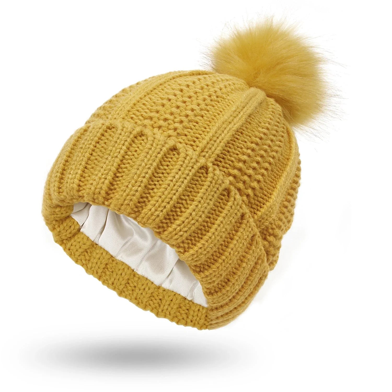 Stylish knit beanie with satin lining and faux fur pom-pom for women, available in multiple color options