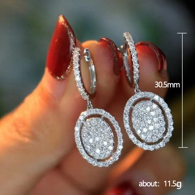 Elegant white gold plated oval earrings for women, perfect for any occasion.