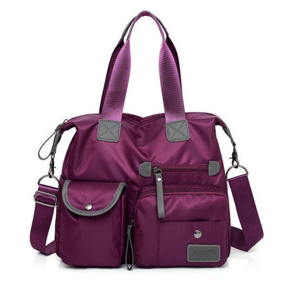 Versatile ladies shoulder bag with multiple carry options, numerous pockets, and durable Oxford fabric construction