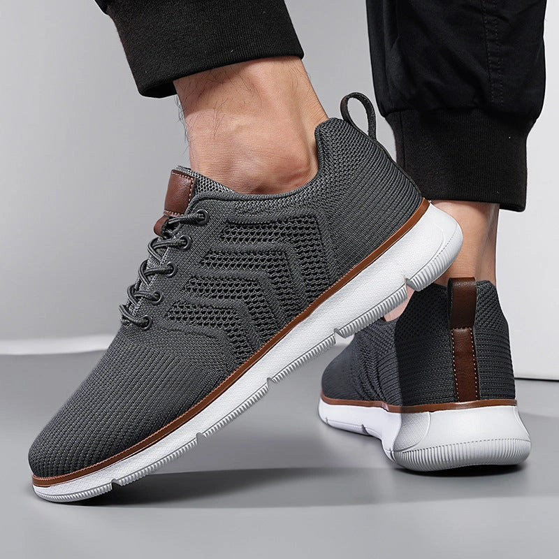 Men's black lace-up mesh sneakers with round toe design