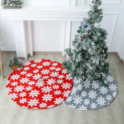 Soft, plush Christmas tree carpet skirt in red and grey, adding festive charm to a living room