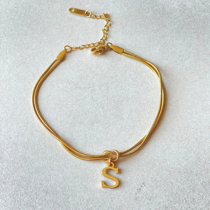 Personalised gold and silver love knot bracelets for couples, perfect as Valentine's Day gifts.