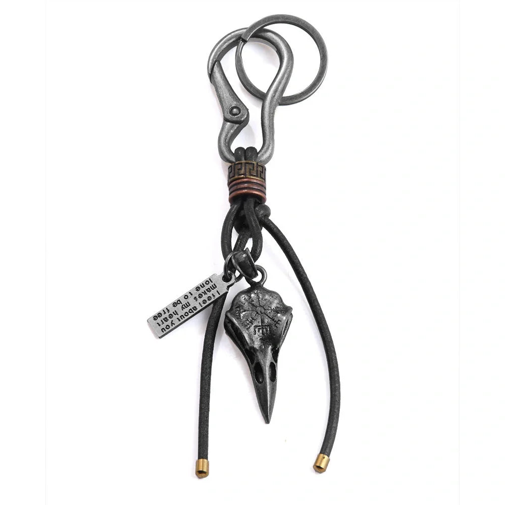 Retro leather keychain with lobster clasp and skull motif in bronze and silver