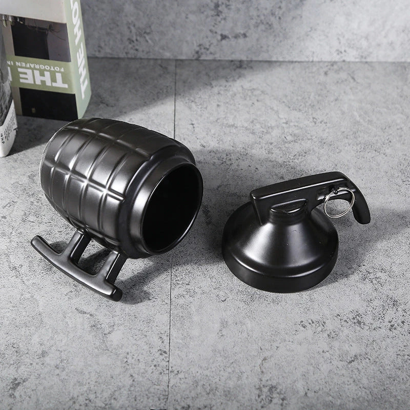 Grenade-shaped ceramic travel mug with secure lid, designed with a military-inspired style for use at home, work, or on the go