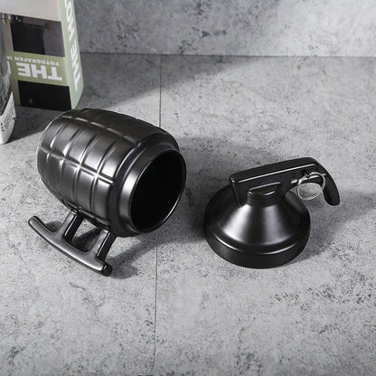 Grenade-shaped ceramic travel mug with secure lid, designed with a military-inspired style for use at home, work, or on the go