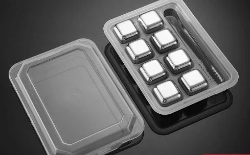 Premium stainless steel whisky chilling stones set in various shapes and sizes, including square, circular, heart, and diamond-shaped stones