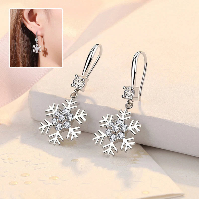 Elegant snowflake earrings with sparkling rhinestones, a festive fashion accessory for women