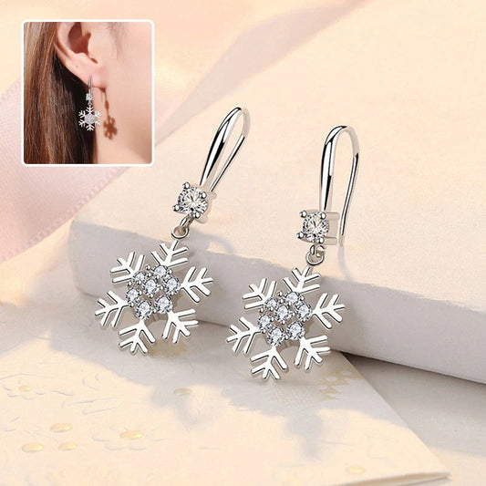 Elegant snowflake earrings with sparkling rhinestones, a festive fashion accessory for women