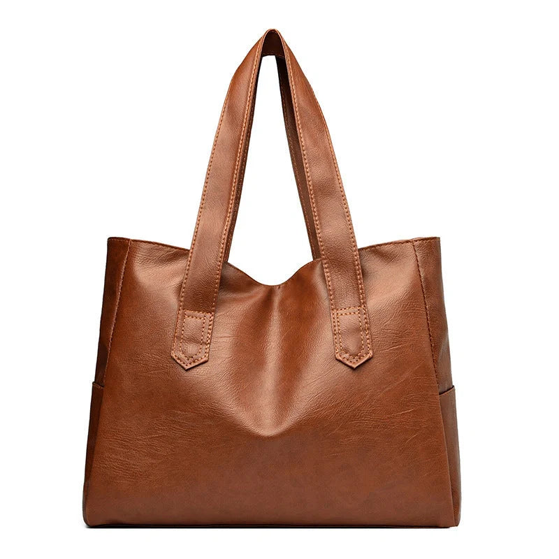 Stylish large capacity commuter shoulder bag in brown and black for autumn and winter