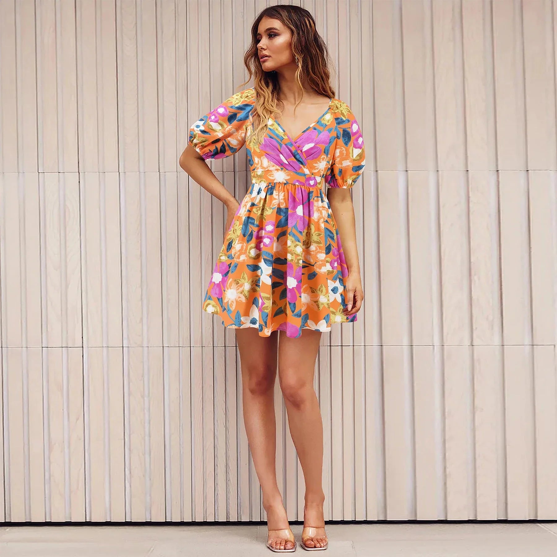 Stylish floral dress with V-neck and lantern sleeves, perfect for summer vacations and warm-weather occasions