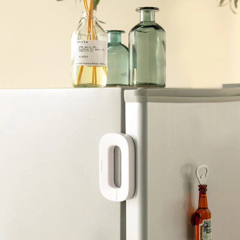 White and grey toddler safety lock for refrigerator doors with easy one-handed operation