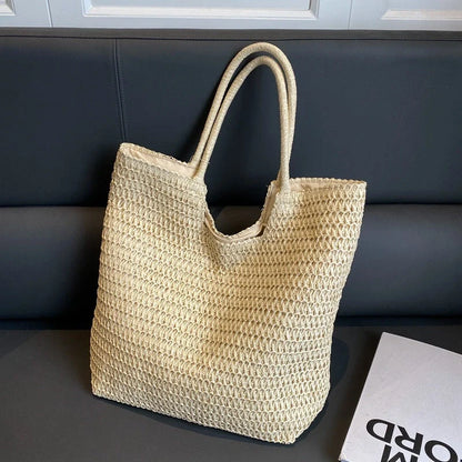 A stylish and spacious straw tote bag in brown and beige colours, perfect for British women on the go.