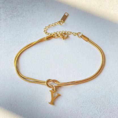 Personalised gold and silver love knot bracelets for couples, perfect as Valentine's Day gifts.