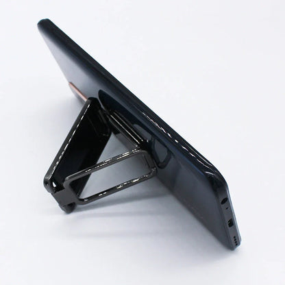 Adjustable folding mobile phone holder stand with multi-angle design, compatible with various smartphones and tablets