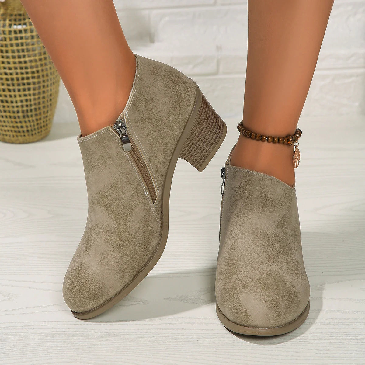 Women's chunky heel ankle boots with side zipper in navy blue, black, and khaki