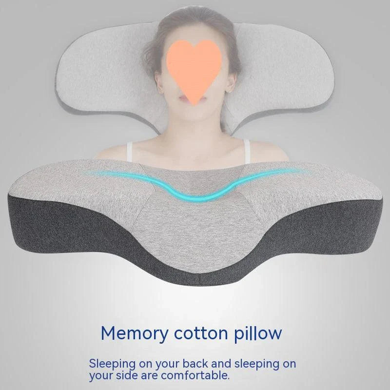 Cozy contoured memory foam pillow with gray cover, providing optimal neck support and comfort for a restful night's sleep.