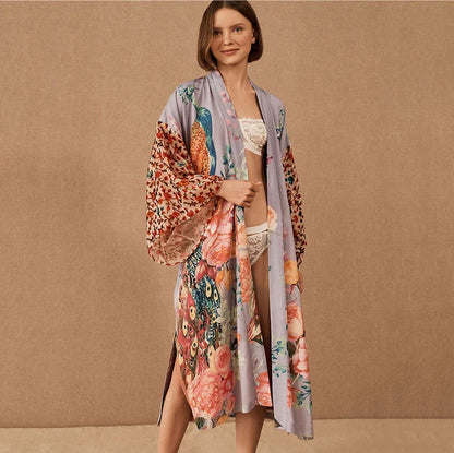 Elegant peacock-printed beach cover-up with lightweight, breathable fabric for stylish sun protection