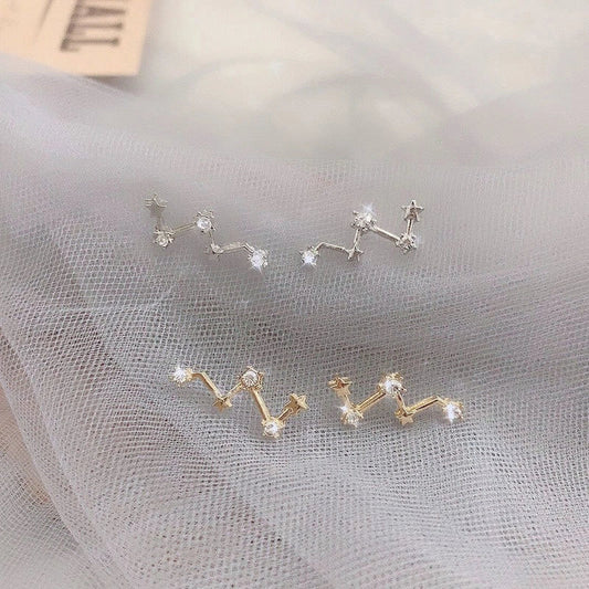Geometric frosty style stud earrings in gold and silver, showcasing modern design and durability