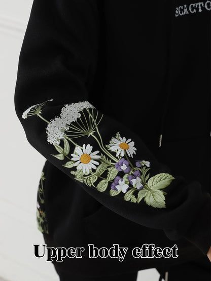 Women's floral long sleeved sweatshirt in black, blue, and apricot