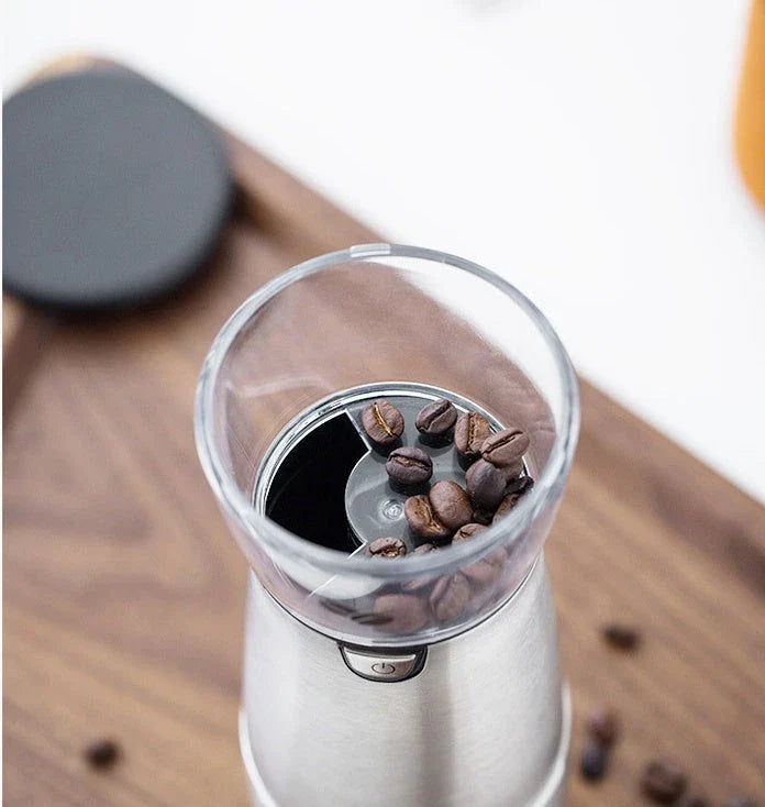 Premium stainless steel electric coffee grinder with adjustable grind settings, USB charging, and sleek modern design