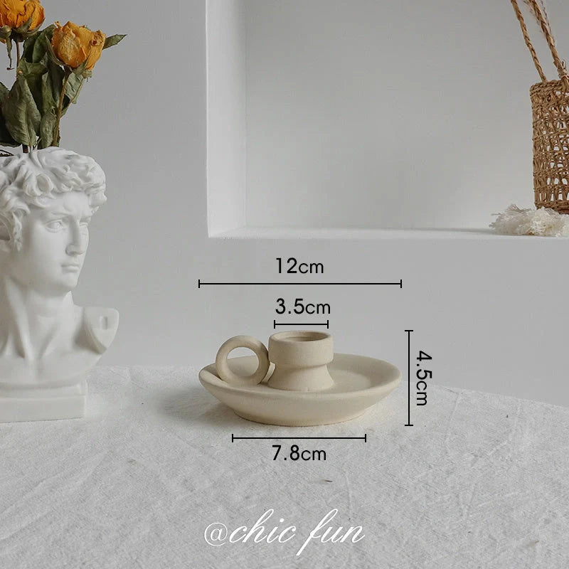 Rustic ceramic vase with matte textured finish for displaying dried flower arrangements in a Scandinavian-inspired home decor setting