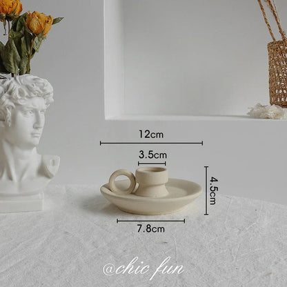 Rustic ceramic vase with matte textured finish for displaying dried flower arrangements in a Scandinavian-inspired home decor setting