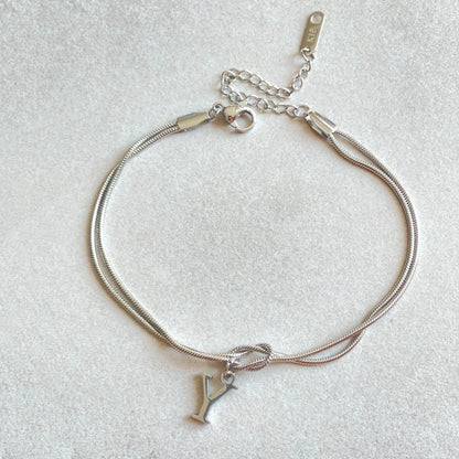 Personalised gold and silver love knot bracelets for couples, perfect as Valentine's Day gifts.