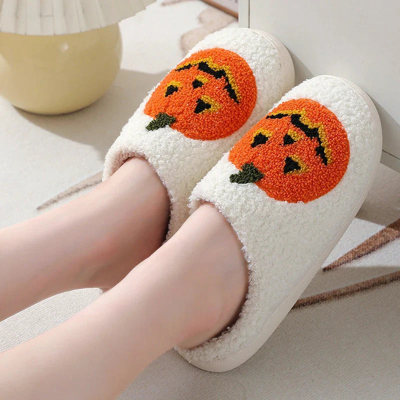 Cozy pumpkin-themed slippers with plush suede upper and non-slip rubber sole for indoor comfort